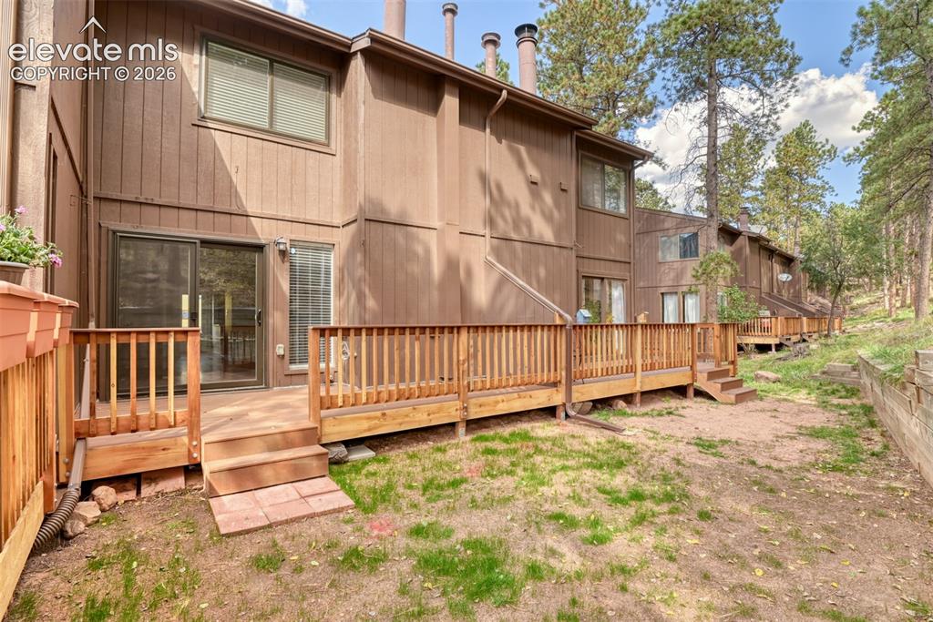 Image 6 of 50: Private wood deck with wood railings