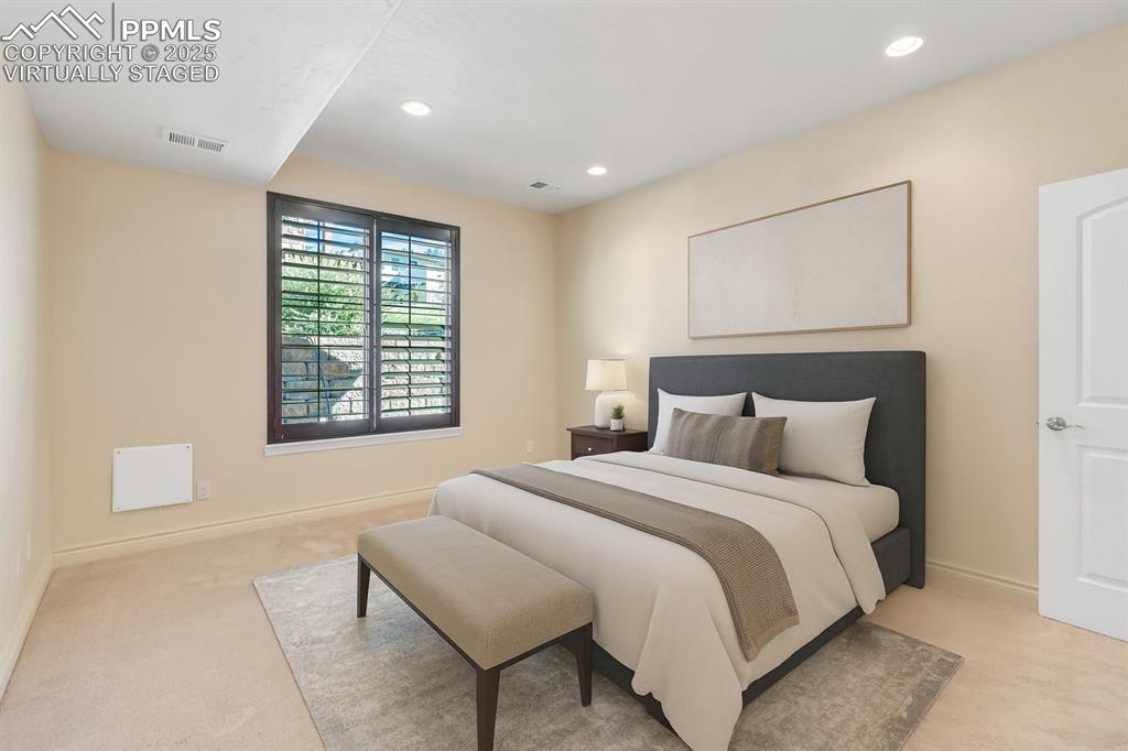 Image 12 of 41: Virtually staged. Main level primary suite. 