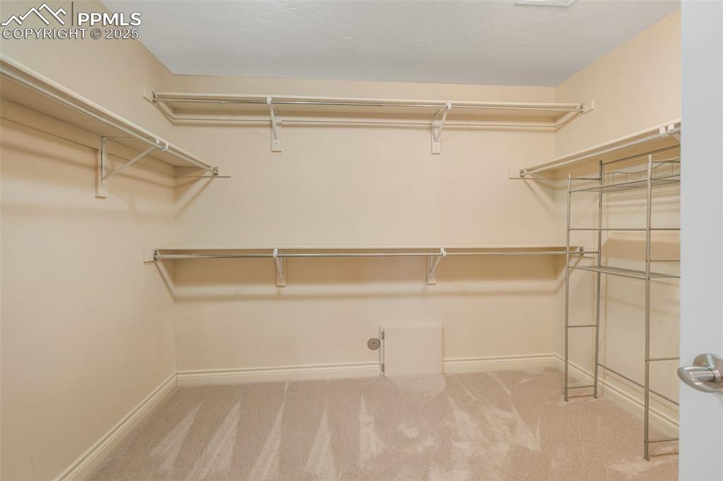Image 15 of 41: Primary bedroom closet. 