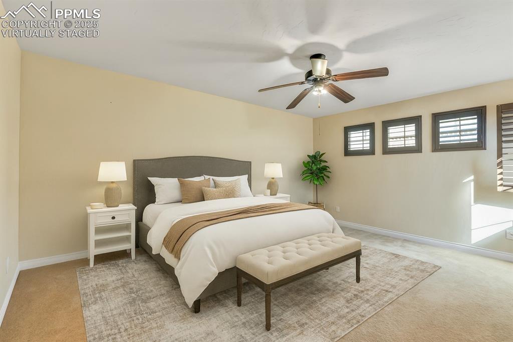 Image 22 of 41: Virtually staged. Upper level bedroom. 