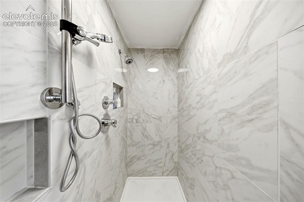 Image 17 of 40: Master Bathroom upgraded tile shower.