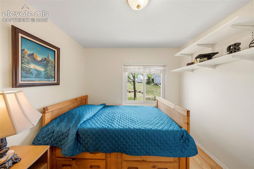Image 21 of 40: Bright interior room featuring a window with exterior views, light wood-fin