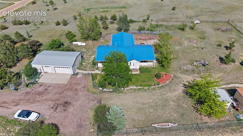 Image 38 of 40: Aerial view showing main house and 4 car garage.
