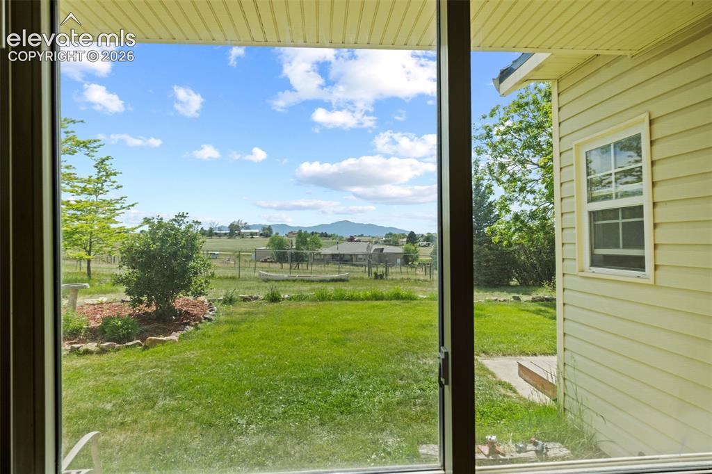 Image 6 of 40: View of Pikes Peak from living room window
