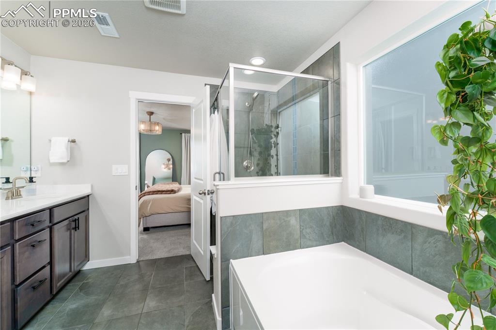 Image 15 of 38: primary suite 5 piece bathroom