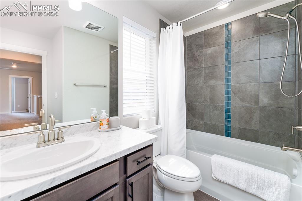 Image 18 of 38: upstairs full bath 