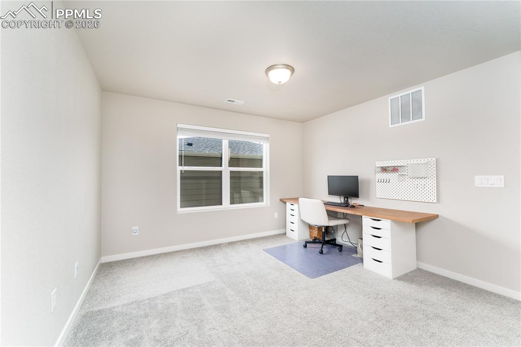 Image 22 of 38: upstairs bedroom 