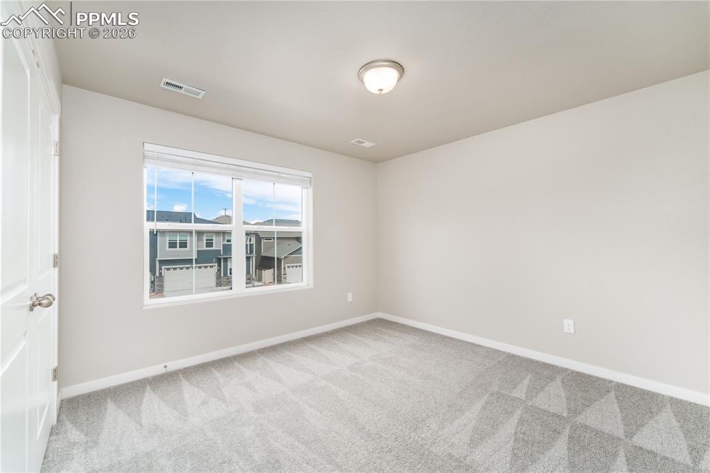 Image 24 of 38: upstairs bedroom 