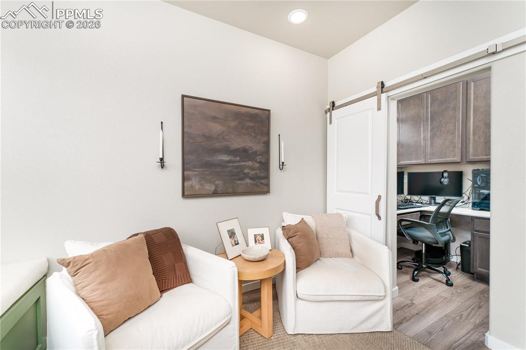 Image 5 of 38: Front sitting room with pocket office