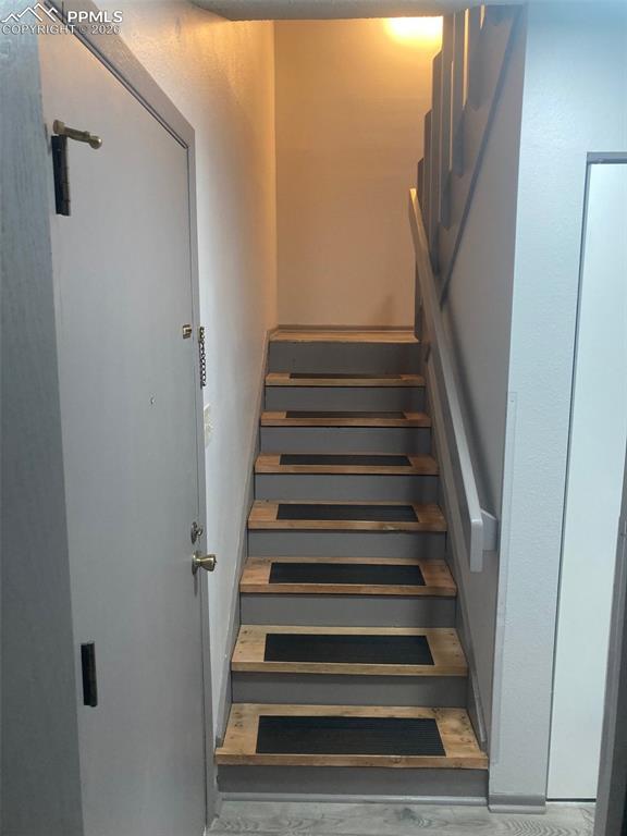 Image 14 of 26: Stairs to upper level