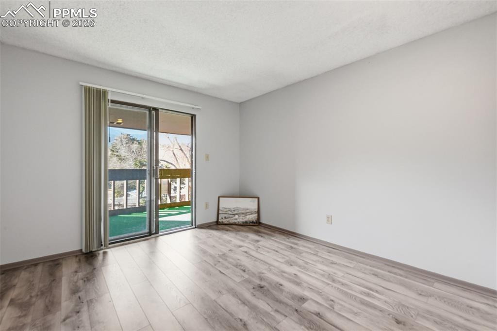 Image 16 of 26: Primary Bedroom with balconey walk out.