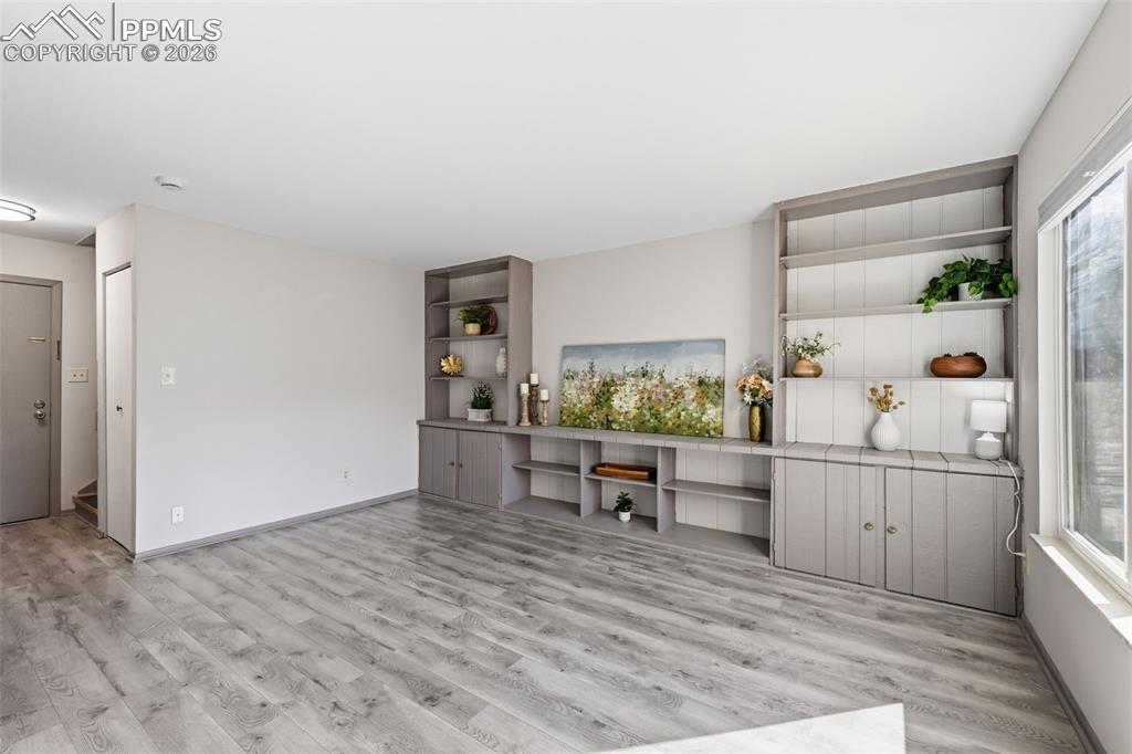 Image 5 of 26: Living room with built ins
