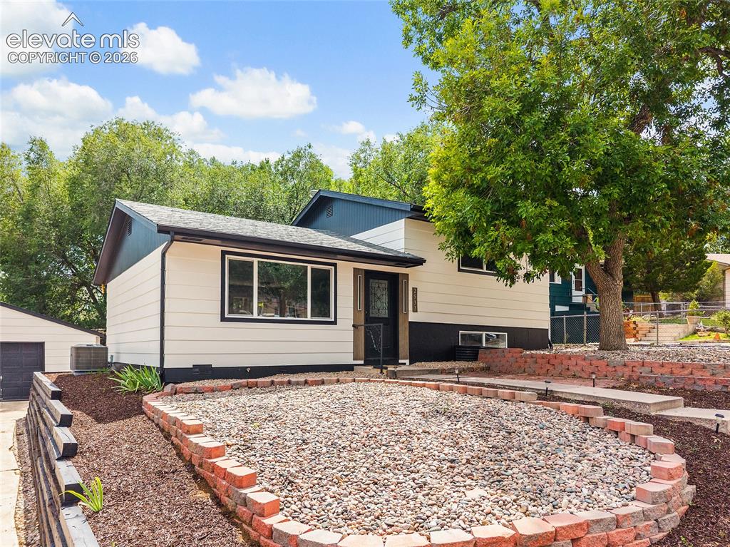 Image 1 of 49: Single-story home featuring a two-tone exterior, attached garage, and a lan