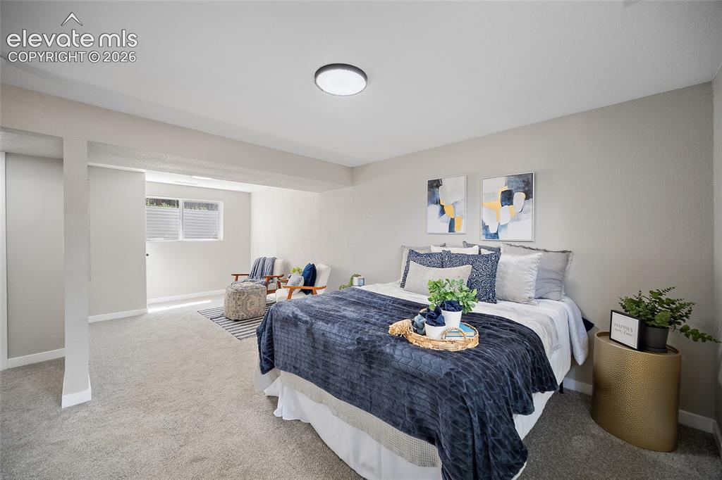 Image 33 of 49: Carpeted flooring, recessed ceiling lighting, light-toned walls, and a wind