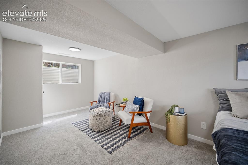 Image 34 of 49: Recessed window with privacy blinds, light gray wall paint, and gray carpet