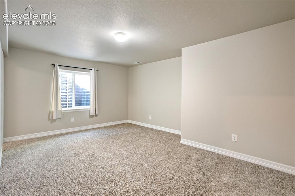 Image 39 of 47: Recessed window with white trim, light-toned walls, neutral carpeting, and 