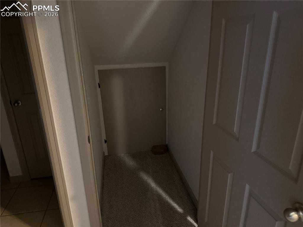 Image 24 of 28: Door to crawl space