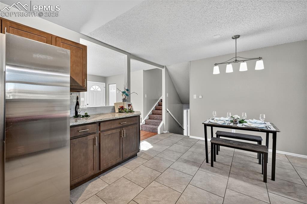 Image 12 of 46: One more view showing the half flight of stairs down and the half flight up