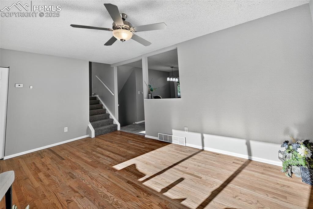Image 2 of 46: Just inside the front door. Newly refinished hardwood floors in the living 