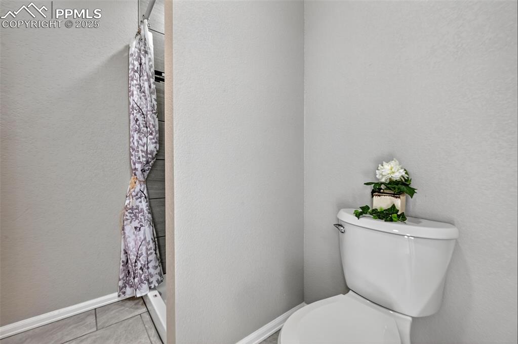 Image 20 of 46: The shower in the master bathroom with new custom tile.