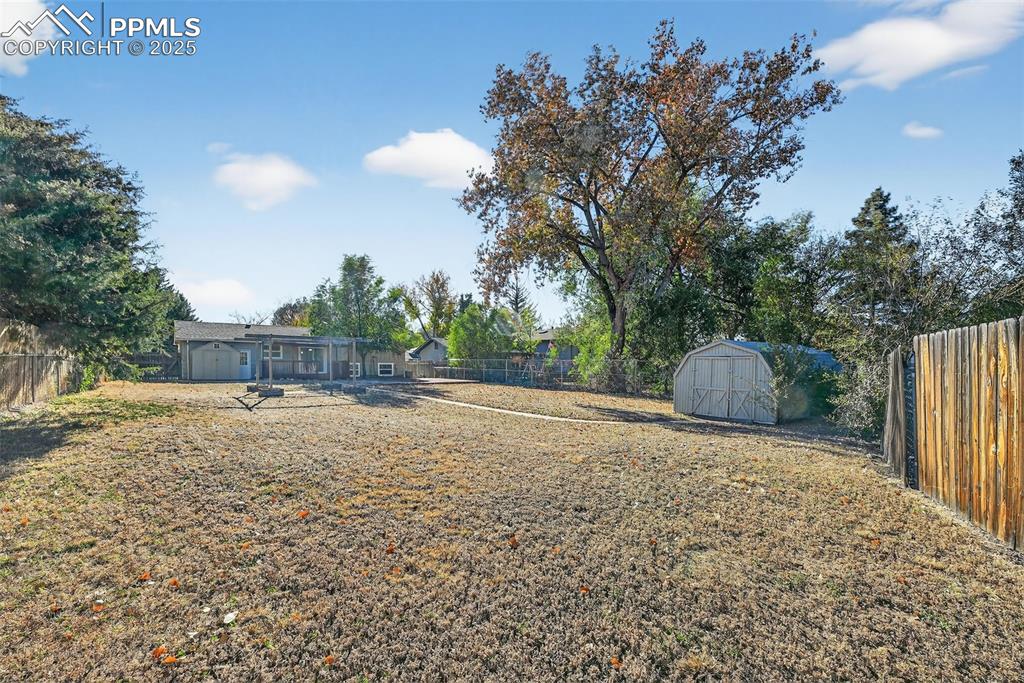 Image 42 of 46: From the far side of the yard. Imagine enjoying this year round.