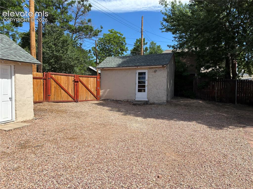 Image 26 of 26: Detached workshop and garage located in the backyard.