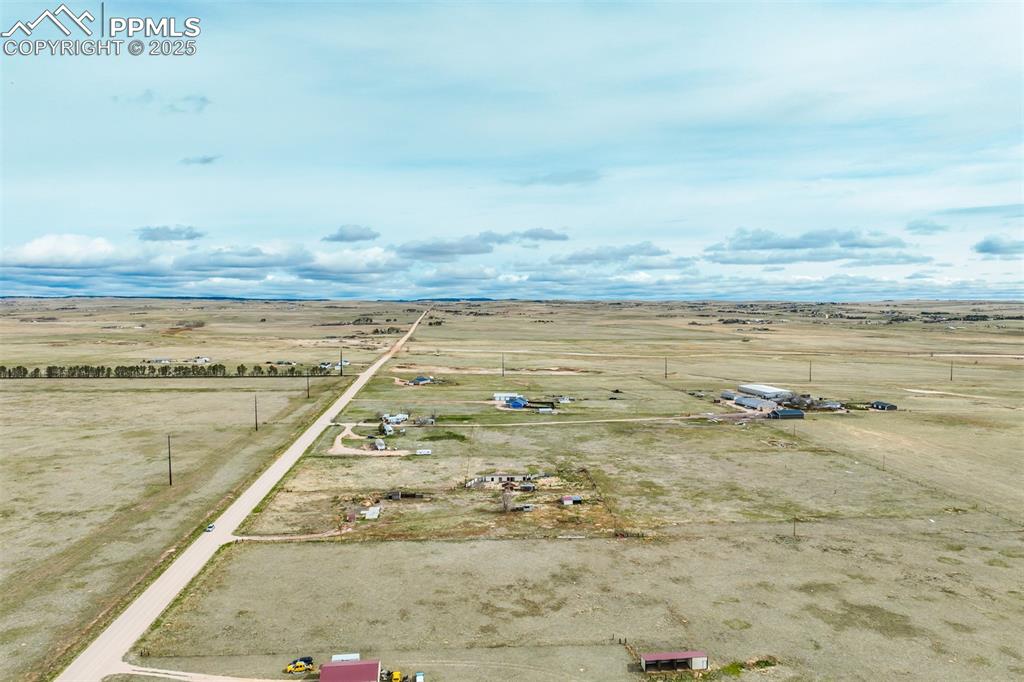 Image 23 of 25: Birds eye view of property featuring a rural view