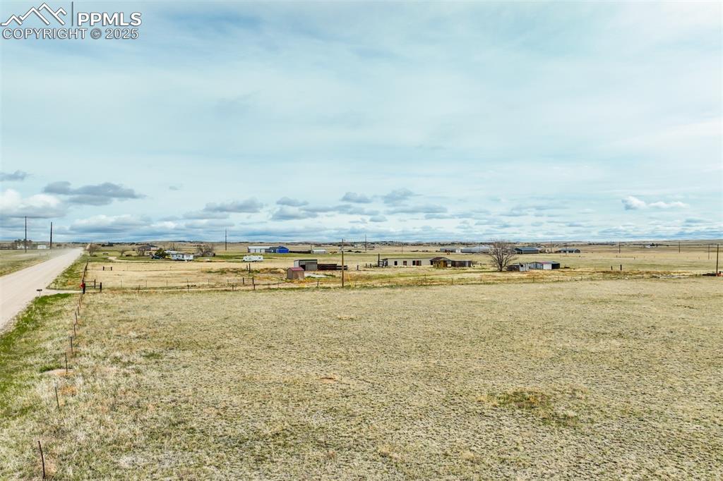 Image 5 of 25: View of yard featuring fence and a rural view