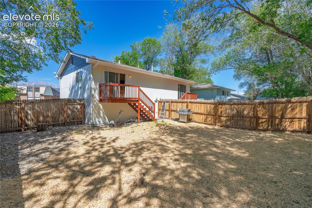 Image 31 of 32: Spacious backyard featuring a full perimeter wood fence, private wood deck 