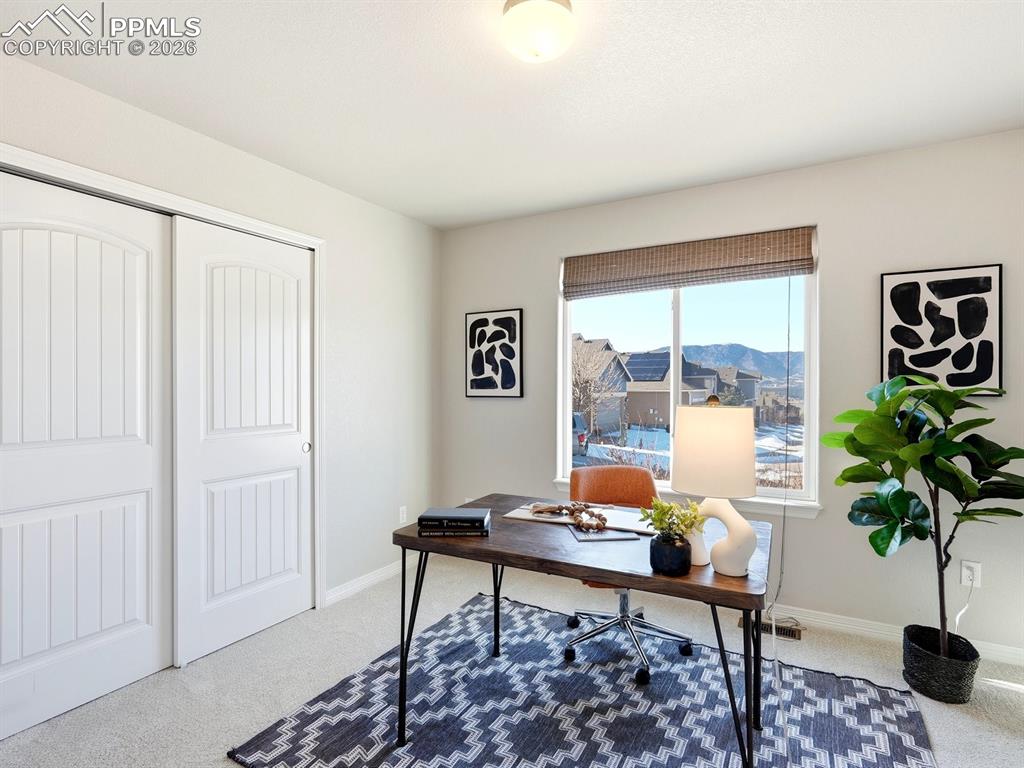 Image 22 of 49: Spacious office with mountain views