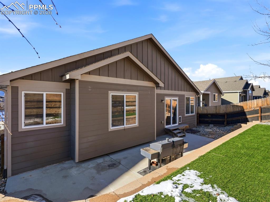 Image 47 of 49: Pet-friendly turf grass creates a low-maintenance yard