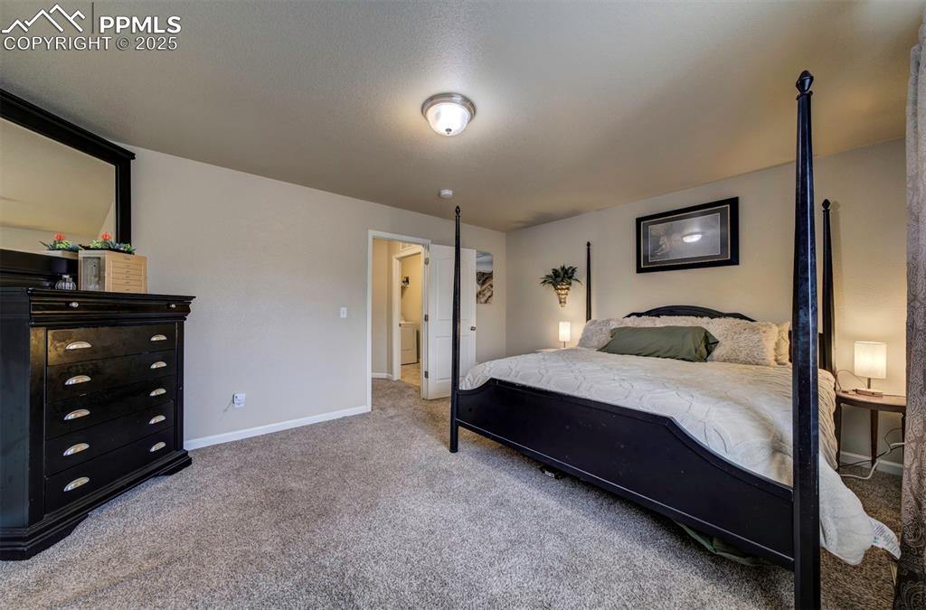 Image 14 of 34: Carpeted bedroom with baseboards