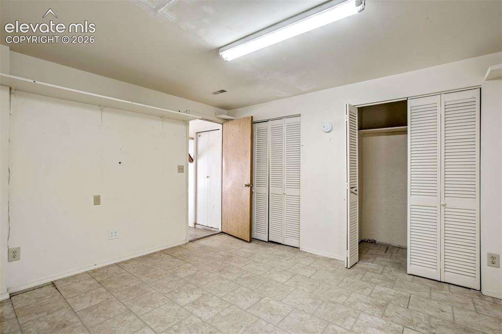 Image 39 of 44: Storage room- located off the garage