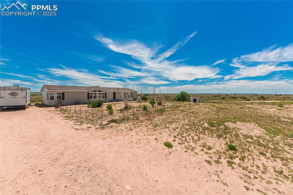 Image 45 of 48: View of yard with driveway