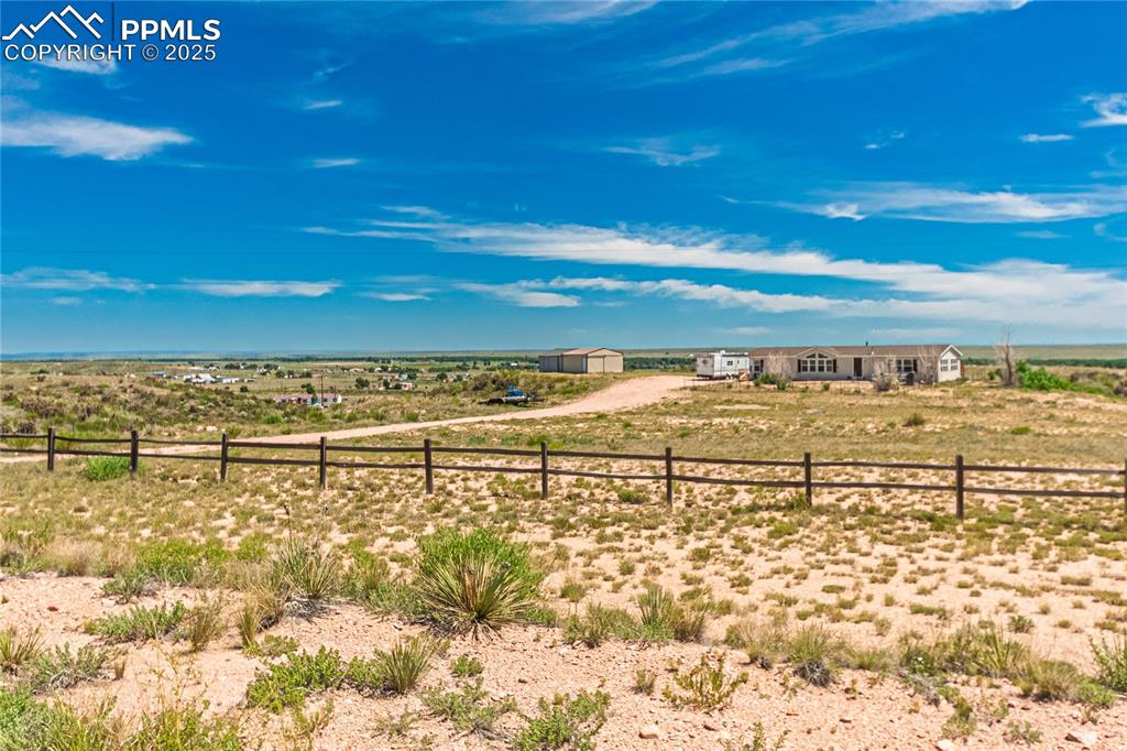 Image 48 of 48: View of yard featuring a view of rural / pastoral area and an outdoor struc