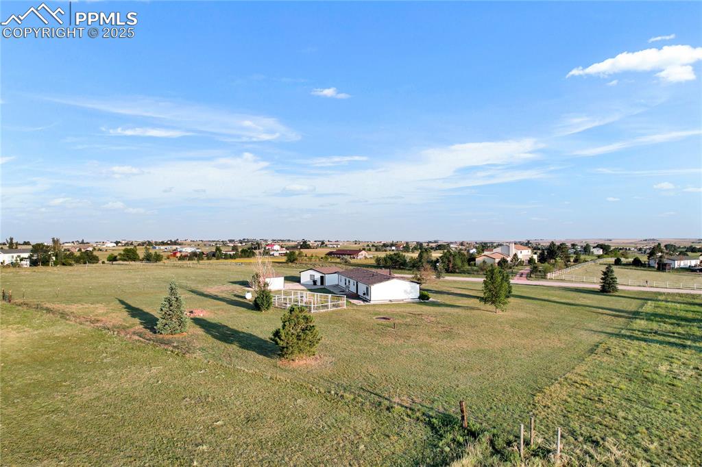 Image 32 of 34: Birds eye view of property with a rural view