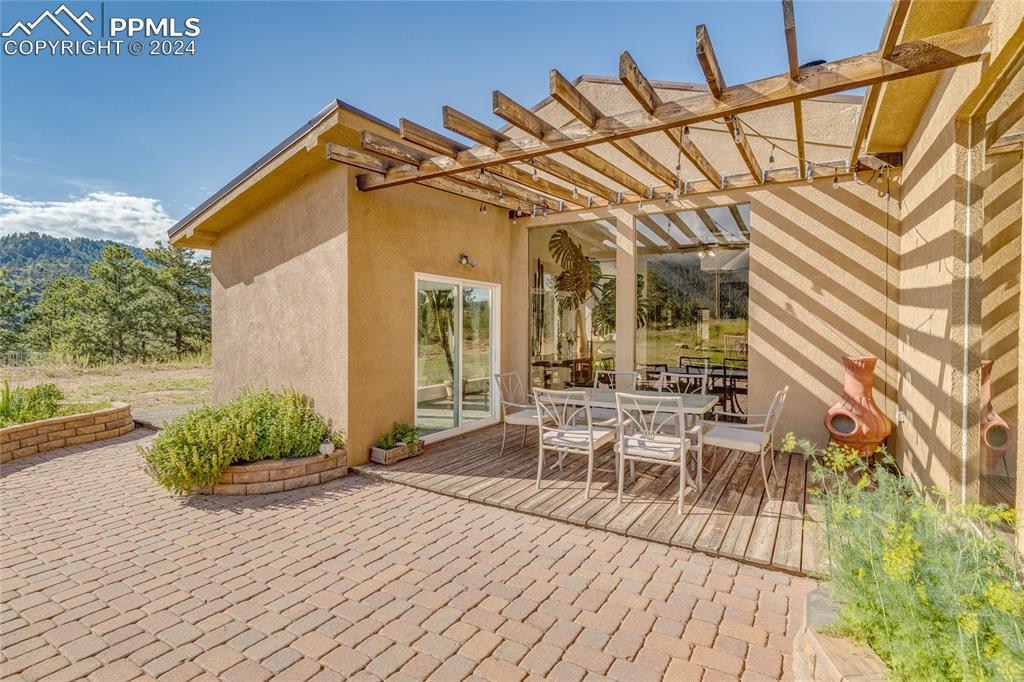 Image 29 of 47: View of patio featuring a pergola