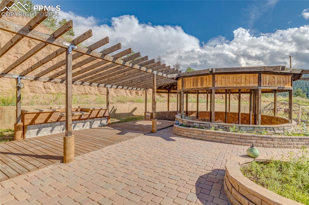 Image 30 of 47: View of patio with a pergola