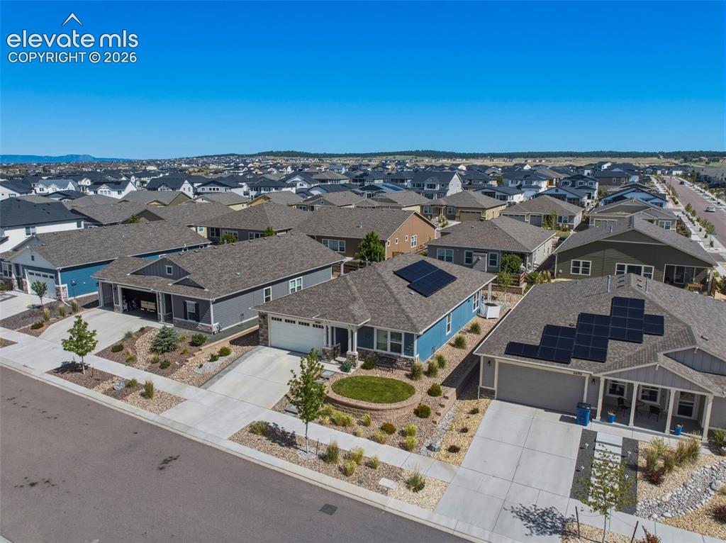 Image 22 of 25: Neighborhood streetscape featuring several single-story homes