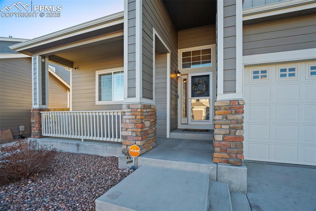 Image 45 of 47: Covered front porch - perfect for a few rocking chairs. 