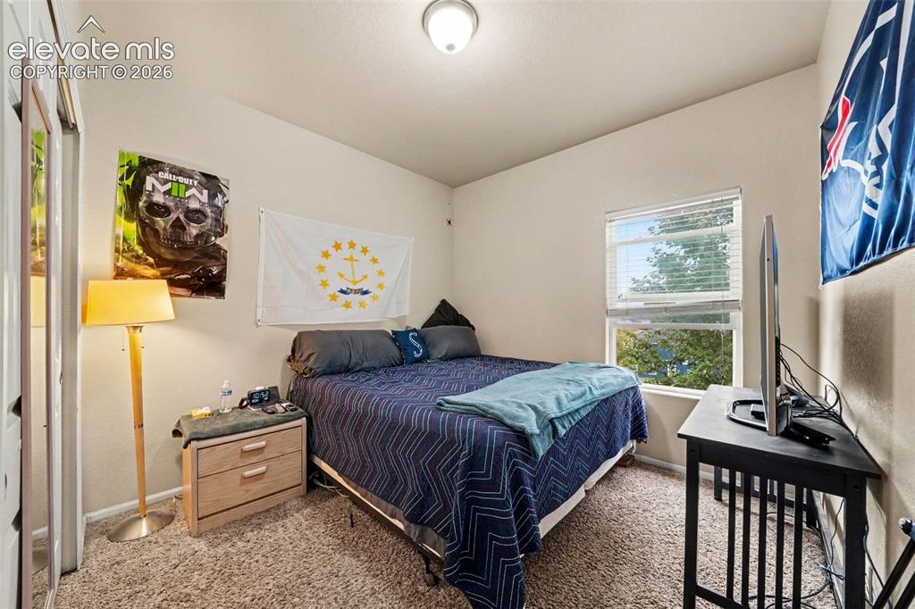 Image 10 of 21: 2nd main floor bedroom