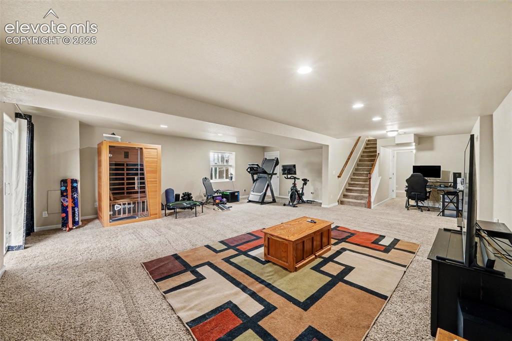 Image 13 of 21: Expansive family room in the walkout basement