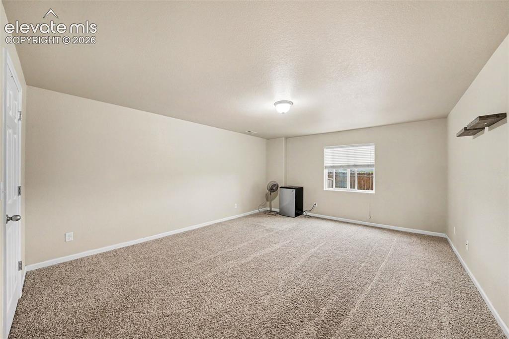 Image 15 of 21: Spacious bedroom located in the basement