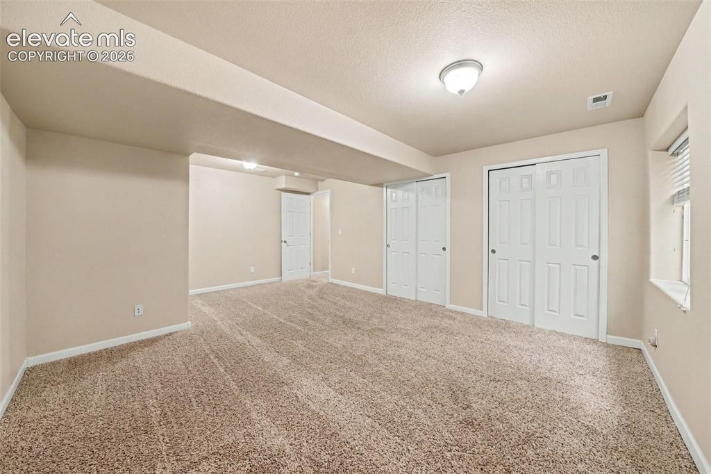 Image 16 of 21: 5th bedroom located in the basement