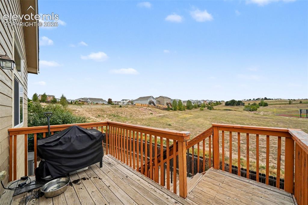 Image 17 of 21: Expansive outdoor deck located off of the dining area that overlooks the ad