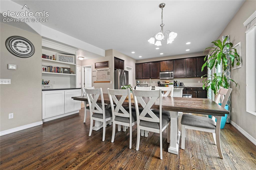 Image 12 of 48: There is extra built-in cabinetry and shelves by your dining room that add 