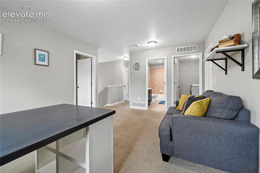 Image 25 of 48: The loft could be a great space for gamers as well, and the laundry is also