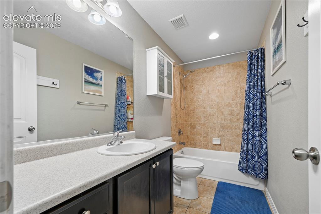 Image 35 of 48: The upstairs full bathroom has extra counter space so that it
