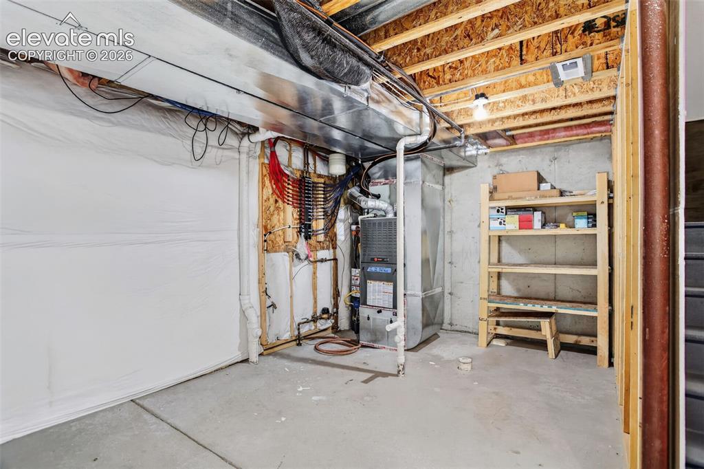 Image 16 of 32: Utility space in unfinished basement