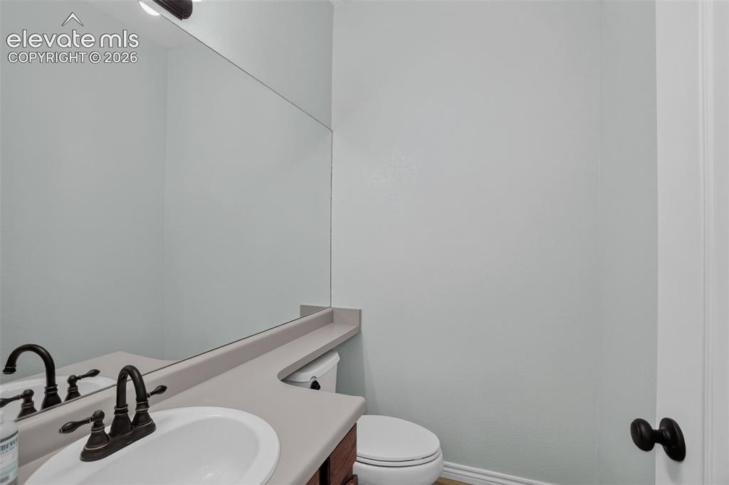 Image 8 of 32: Main floor half bath
